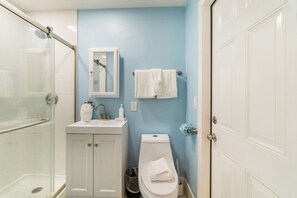 Shower, hair dryer, towels, shampoo
