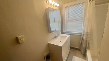 Shower, hair dryer, towels, shampoo