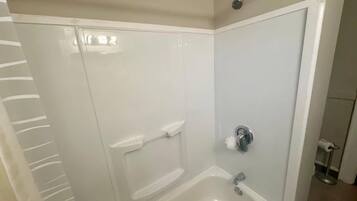 Shower, hair dryer, towels, shampoo