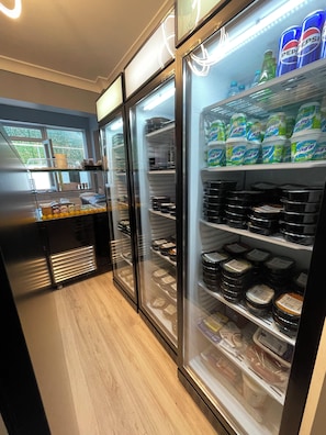 A refrigerated display case with dairy products and condiments. - Nazende (İstanbul)