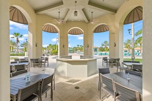 Outdoor dining - ChampionsGate Resort Six Bedroom Vacation Pool Home - Includes resort clubhouse amenity access (Davenport)