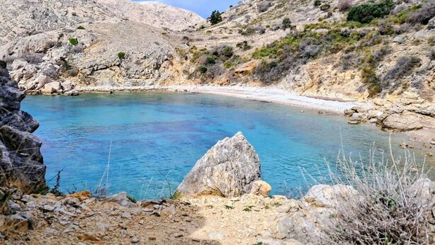 A natural rocky landscape with a clear blue water body, surrounded by rugged terrain. - Villa with swimming pool (Malinska)