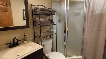Shower, hair dryer, towels, soap