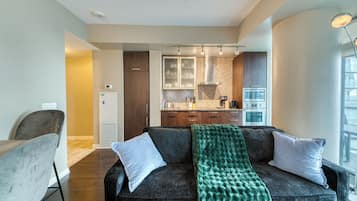 Deluxe Suite, 2 Bedrooms, 2 Bathrooms, City View | Living area | 50-inch flat-screen TV with digital channels