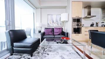 Signature Suite, 1 Bedroom, Non Smoking, Private Bathroom | Living area | 50-inch flat-screen TV with digital channels