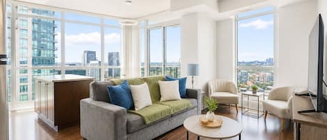 Family Suite, 2 Bedrooms, City View | Living area | 50-inch flat-screen TV with digital channels