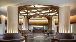 A modern lobby with a reception desk, seating areas, and a unique ceiling design. - WESTIN NANEA OCEAN VILLAS 2 BDRM Resort View Maui, Lahaina
May 29 – June 1, 2026 (Lahaina)