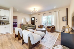 A living room with a sofa, armchairs, a coffee table, a rug, and a television. - 3 Mi to New River Gorge NP! Rafting & Hiking Hub (Fayetteville)