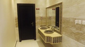 Apartment, 1 Bedroom | Bathroom | Combined shower/bathtub, hair dryer, slippers, towels - QasrAl-Baron Serviced Apartments Almasif (Riyadh)
