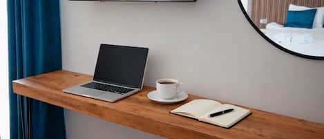 Desk, laptop workspace, blackout curtains, free WiFi