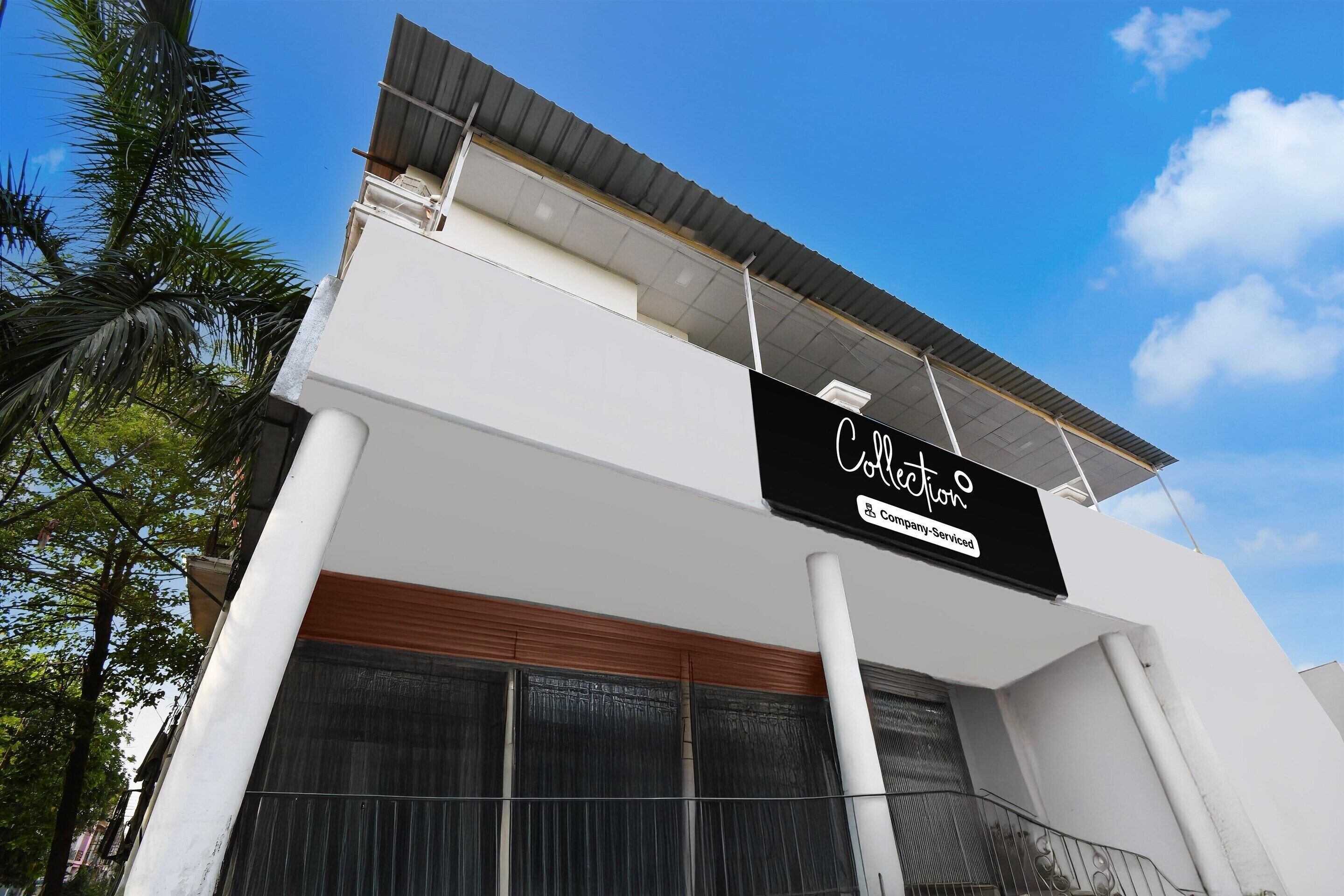 A modern building with a sign that reads 'Collection.'