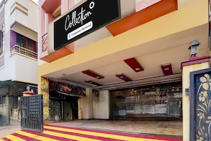 A building with a sign reading 'Collection' and a company-serviced logo.