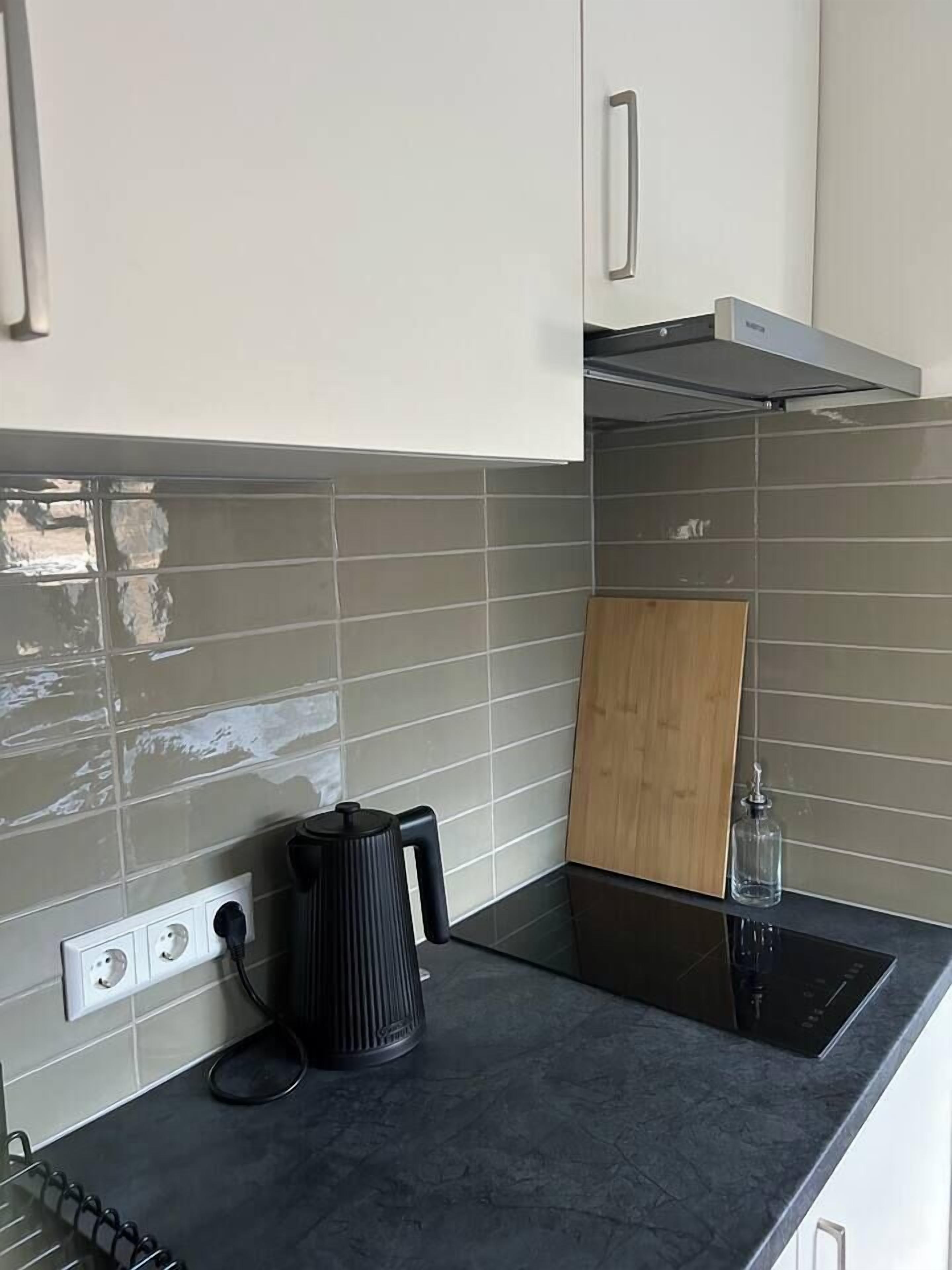 Fridge, stovetop, coffee/tea maker, cookware/dishes/utensils