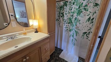 Shower, hair dryer, towels, shampoo