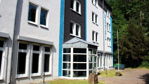 A multi-story hotel with a modern design, featuring large windows and a glass entrance. - 2 Person Holiday Park Home in Bendorf (Bendorf)