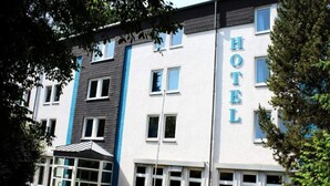 A hotel building with a prominent 'HOTEL' sign, large windows, and a covered entrance area. - 2 Person Holiday Park Home in Bendorf (Bendorf)