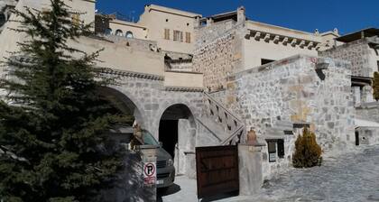 Cave accommodation in Cappadocia with stunning views over valleys and Mt. Argeus