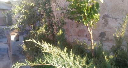 Cave accommodation in Cappadocia with stunning views over valleys and Mt. Argeus