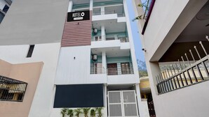 A multi-story hotel with a sign indicating 'HOTEL & Company Service.' - Deluxe Neelam Hotel (Bareilly)