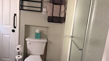 Shower, towels, soap, toilet paper