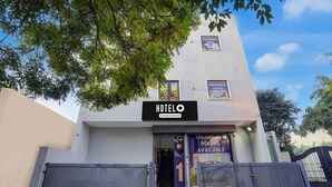 A modern hotel with a sign reading 'HOTELO' and 'Company Serviced.' - Hotel O by OYO Silver Arc Mall Ludhiana (Ludhiana)