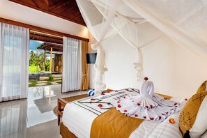 A bedroom with a bed, a canopy, and a view of an outdoor area with plants. - D&O Villa Ubud by Dhananjaya Hospitality (Sebatu)
