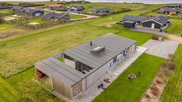 A modern house with a large patio, a small garden, and a view of the sea. - "Safir" - 200m to the fjord by Interhome (Vinderup)