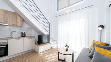 Two Level Apartment | Living area | 40-inch TV with cable channels