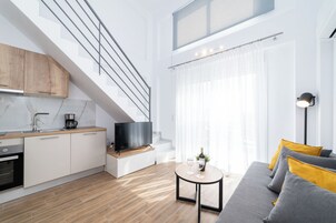 Two Level Apartment | Living area | 40-inch TV with cable channels