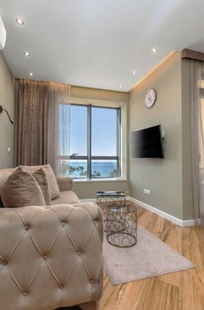 Living area - XIO Apartments | Stylish Comfort with Balconies & Full Kitchens (Bar)