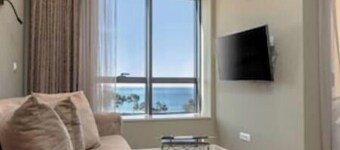 XIO Apartments | Stylish Comfort with Balconies & Full Kitchens
