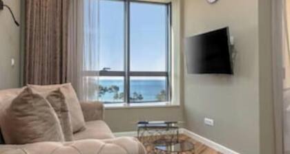 XIO Apartments | Stylish Comfort with Balconies & Full Kitchens