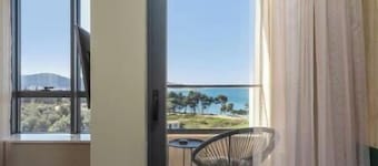 XIO Apartments | Stylish Comfort with Balconies & Full Kitchens