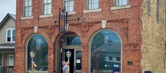 Stay at thee Historic Wenzil Taylor Building! It’s down the road from Decorah!