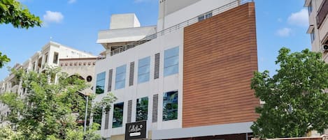 A modern building with a storefront labeled 'Collection.'