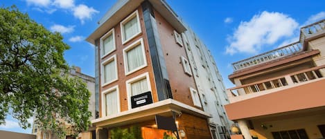 A multi-story building with a sign reading 'Townhouse.'