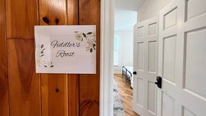 A wooden door with a sign reading 'Fiddler's Rest.' - Fiddler's Roost At The Washington Inn (Fries)
