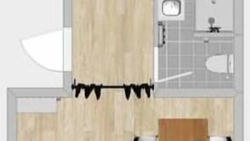 Plano de un cuarto de hotel con cama, escritorio, silla, una mesita y ventana.