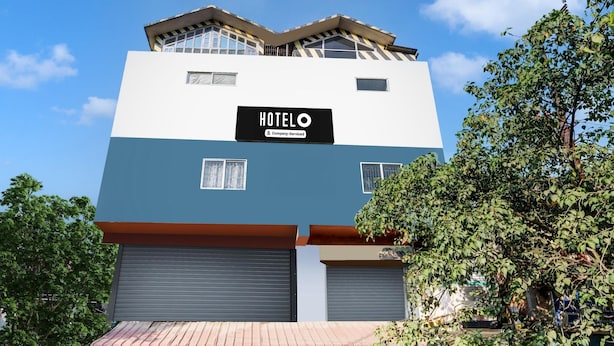 A multi-story hotel with a sign reading 'HOTEL O & Company-Serviced.' - Super Hotel O Noonmati Guwahati (Guwahati)