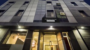 A modern building with a sign reading 'TOWNHOUSE Company-Serviced.' - Super Deluxe Room Golden Temple Amritsar A Star (Amritsar)
