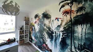 A room with a large mural of a waterfall and tropical forest, a bookshelf, a desk with toys, and a globe hanging from the ceiling. - A Family Spa Getaway Amid Meadows, Birds, and Gardens (Chantepie)