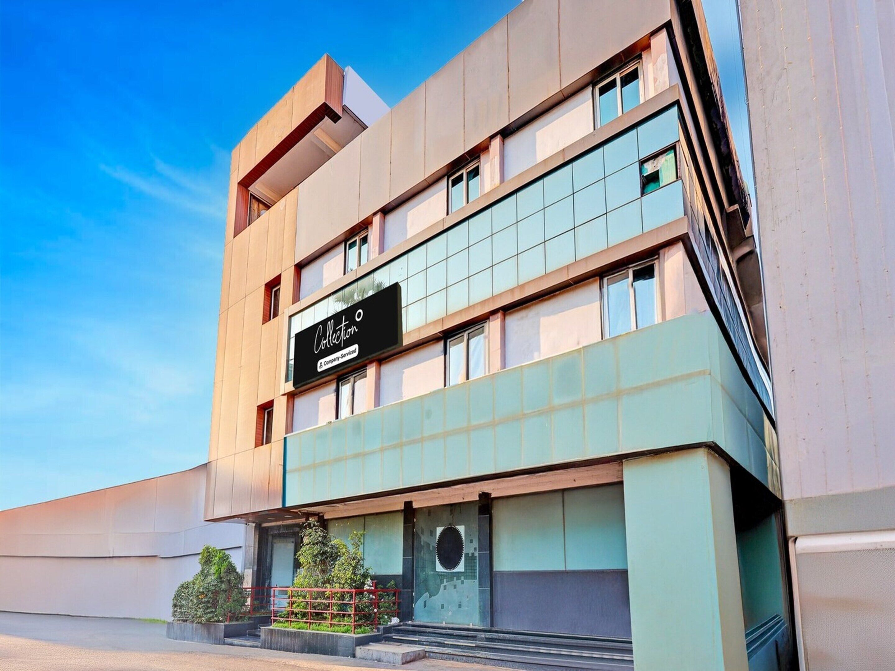A modern building with a sign reading 'Collection.'