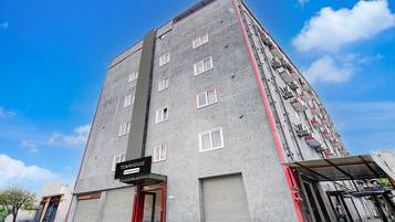 A multi-story building with a sign reading 'TOWNHOUSE.'