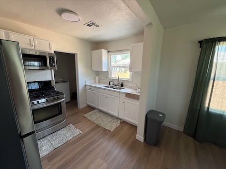 Fridge, microwave, oven, stovetop. 2-bedroom house in soothing Bakersfield with refreshing AC