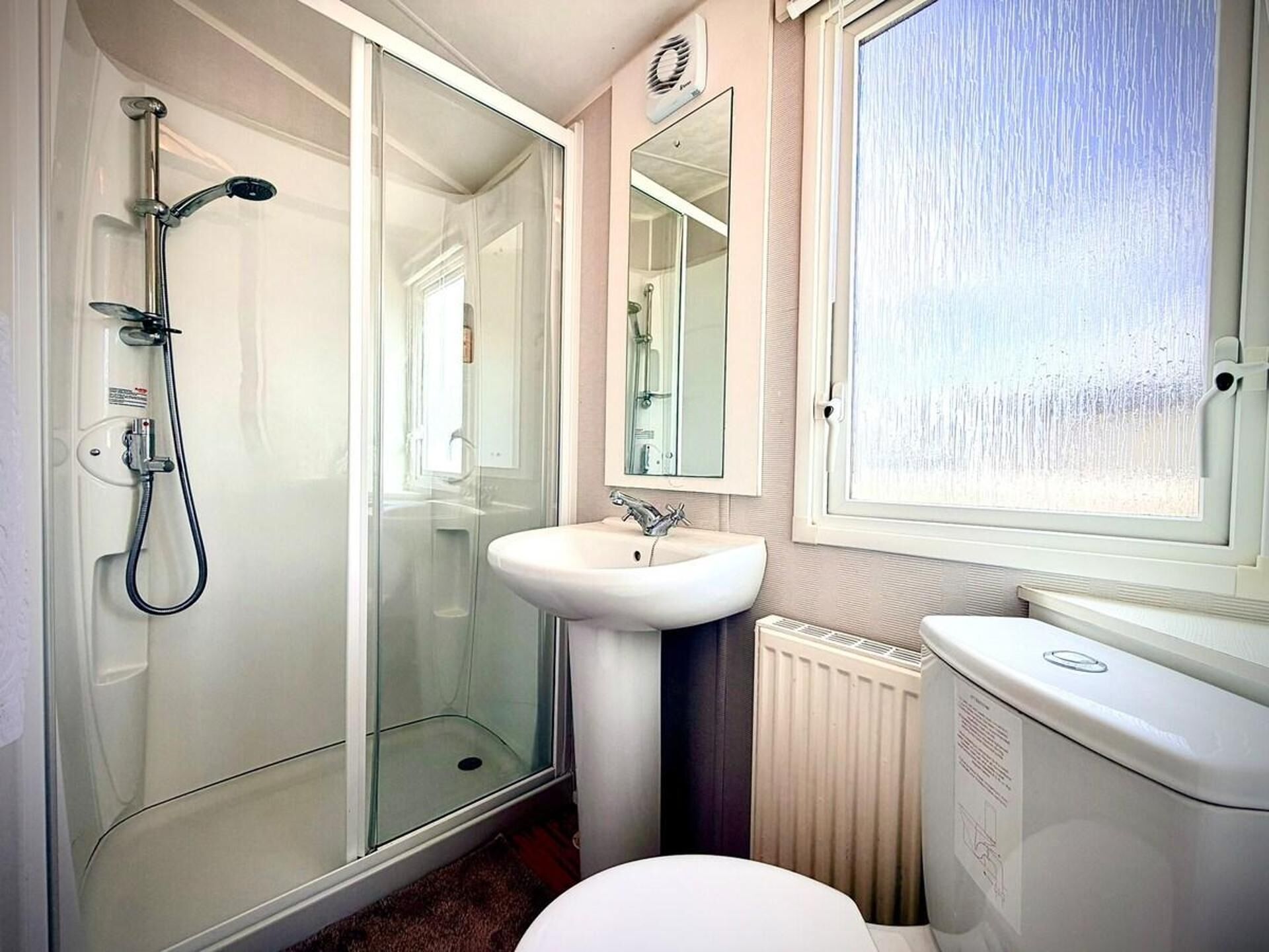Separate bathtub and shower, deep-soaking bathtub, hair dryer, towels
