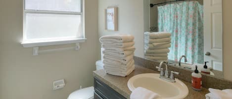 Jetted bath, hair dryer, towels, soap
