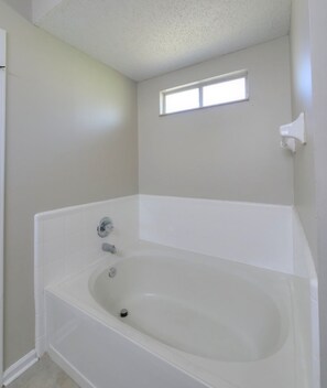 Jetted tub, hair dryer, towels, soap