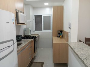 Private kitchen - Comfortable apartment in Bertioga.  (Bertioga)