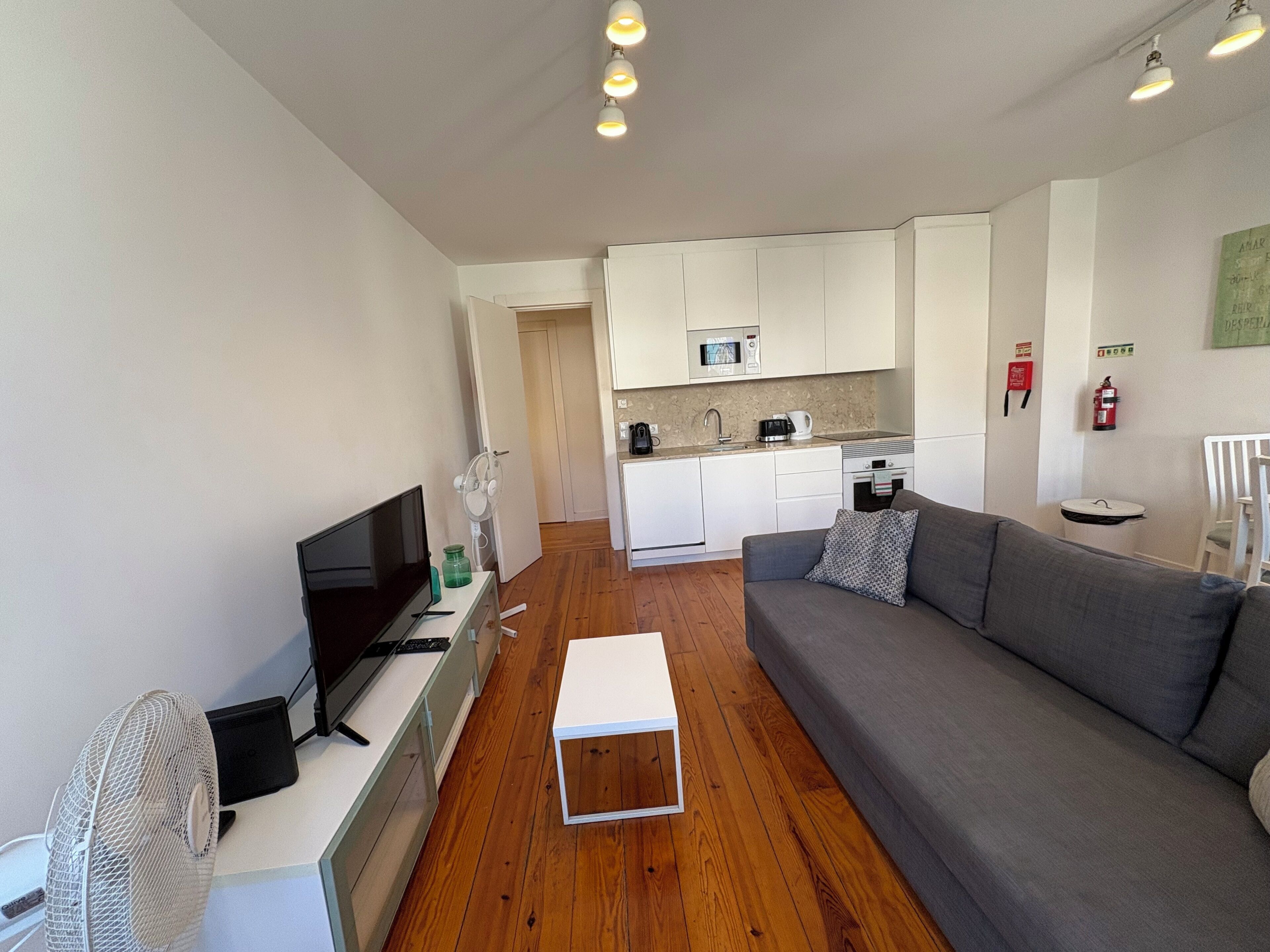 Departamento Deluxe, vista a la ciudad | Área de sala de estar