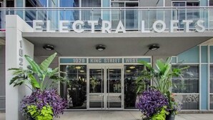 The exterior of Electra Lofts, a modern building with a glass facade, located at 1029 King Street West.
